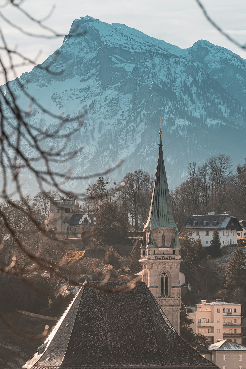 cathedral and houses near mountain