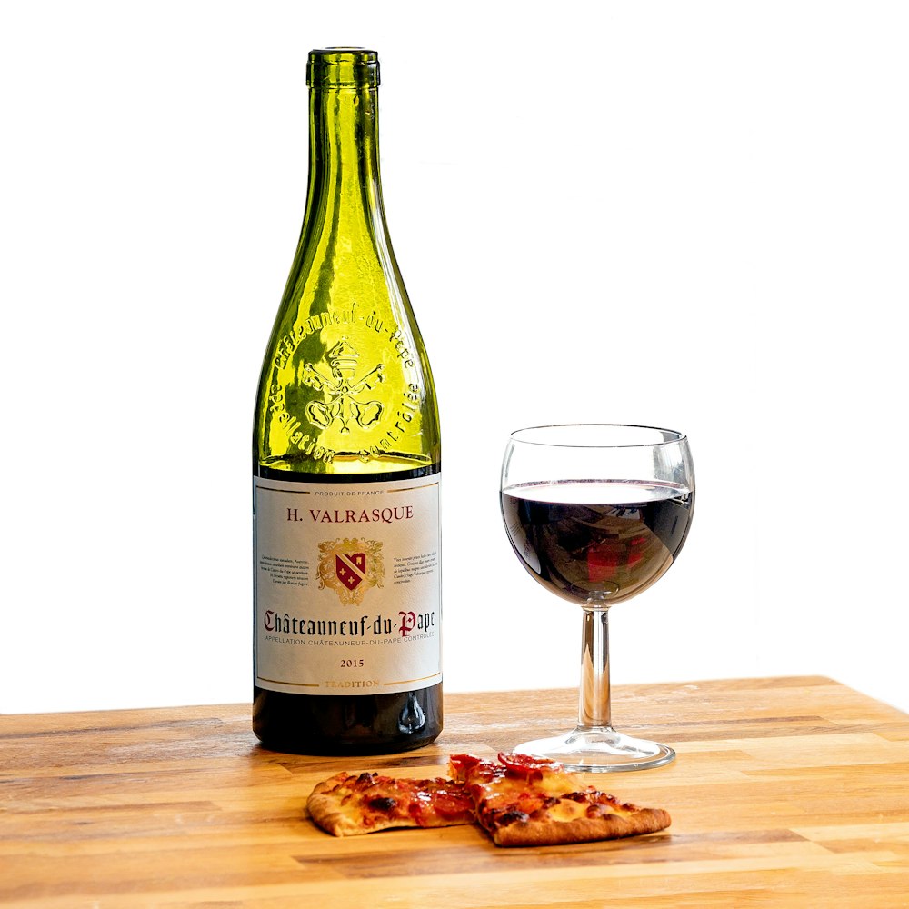 H. Valrasque Chateauneuf-de-Pape bottle and slices of pizza