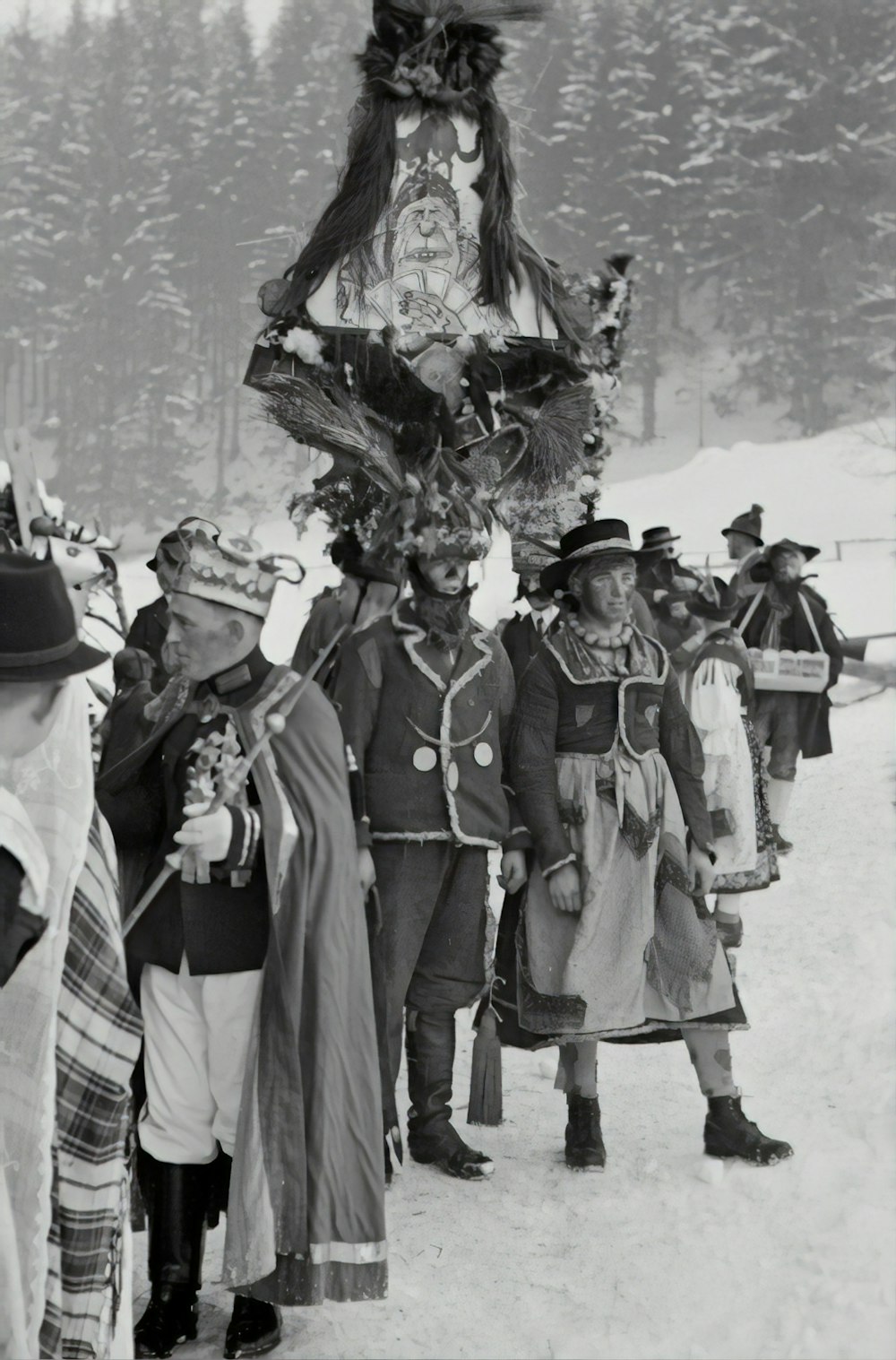 grayscale photography of men standing on snow