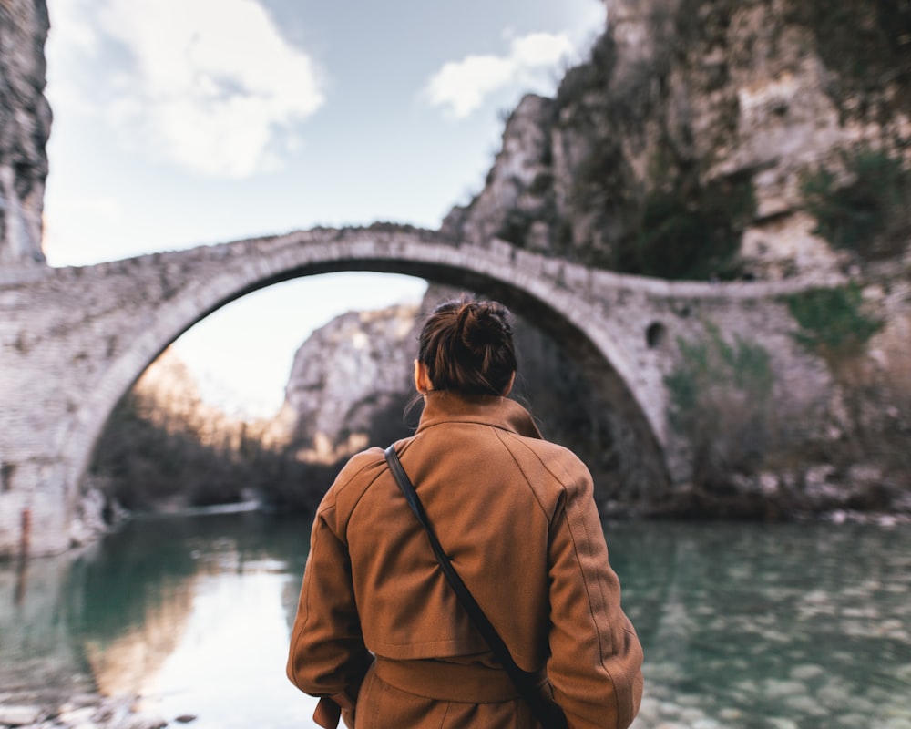 shallow focus photo of person in brown jacket