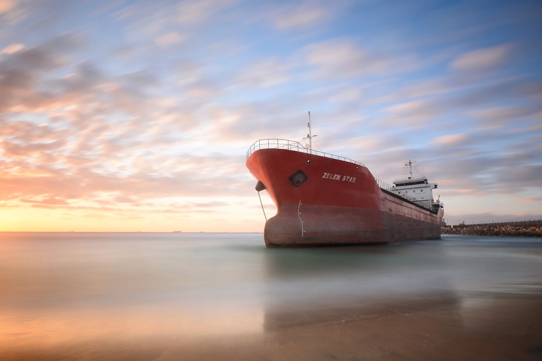 selective focus photography of orange cruise ship during daytime