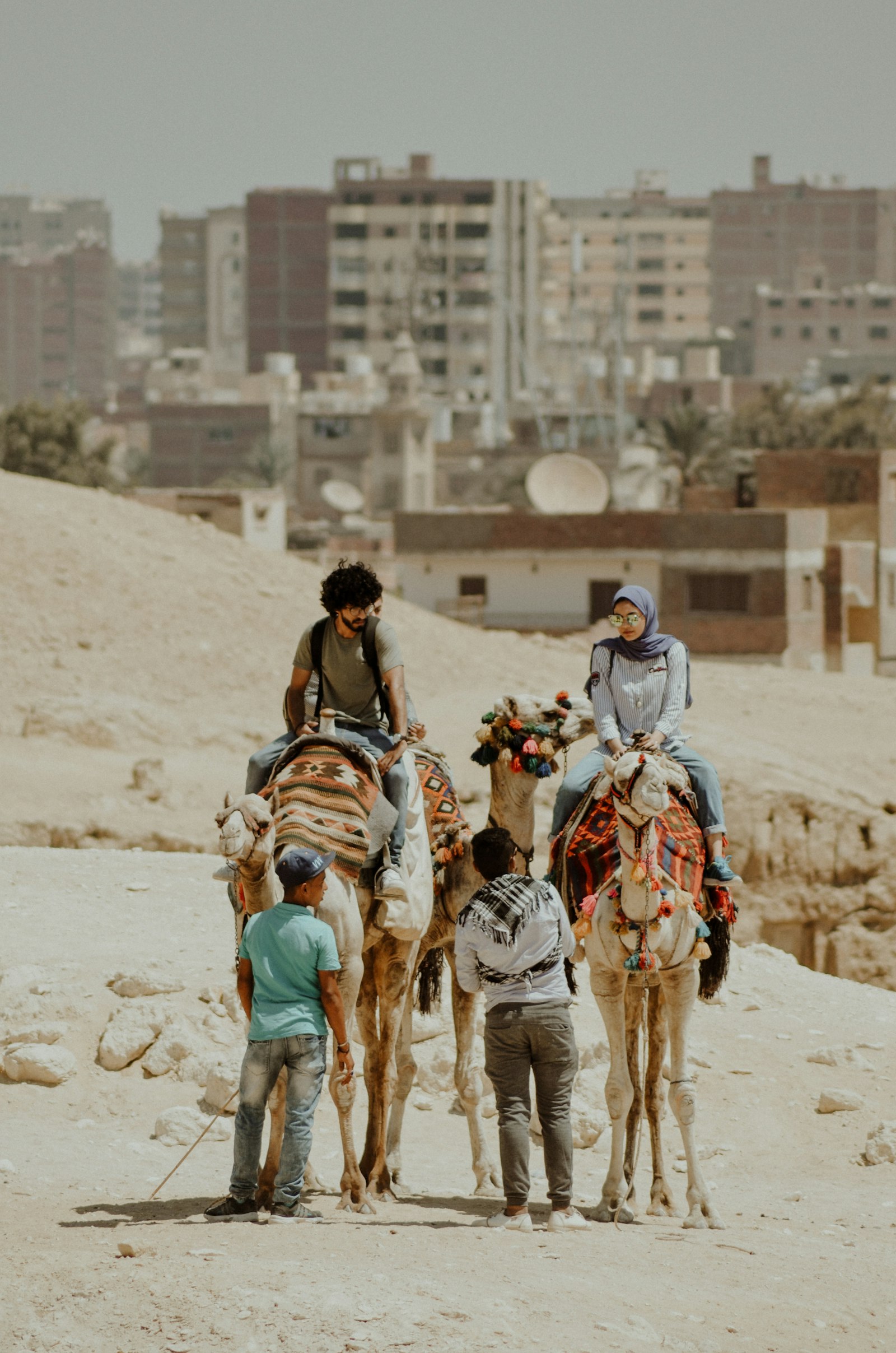 Nikon D5100 + Sigma 50-150mm F2.8 EX APO DC HSM II + 1.4x sample photo. Couple riding on camels photography