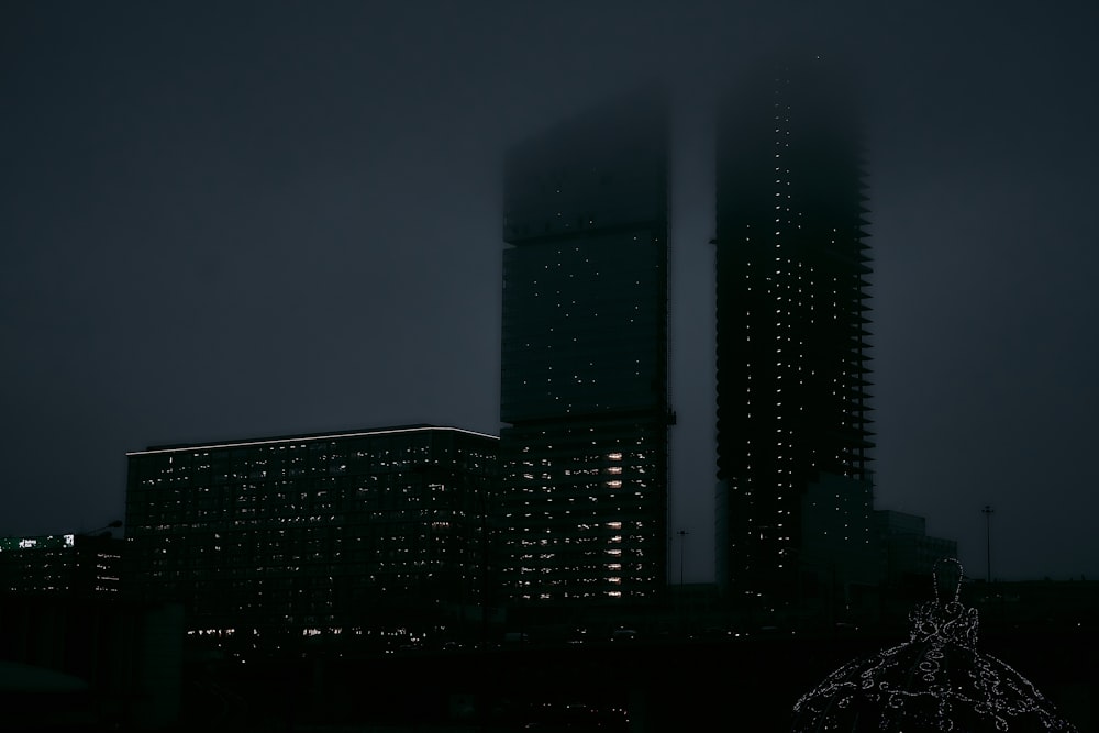 silhouette photography of high rise building