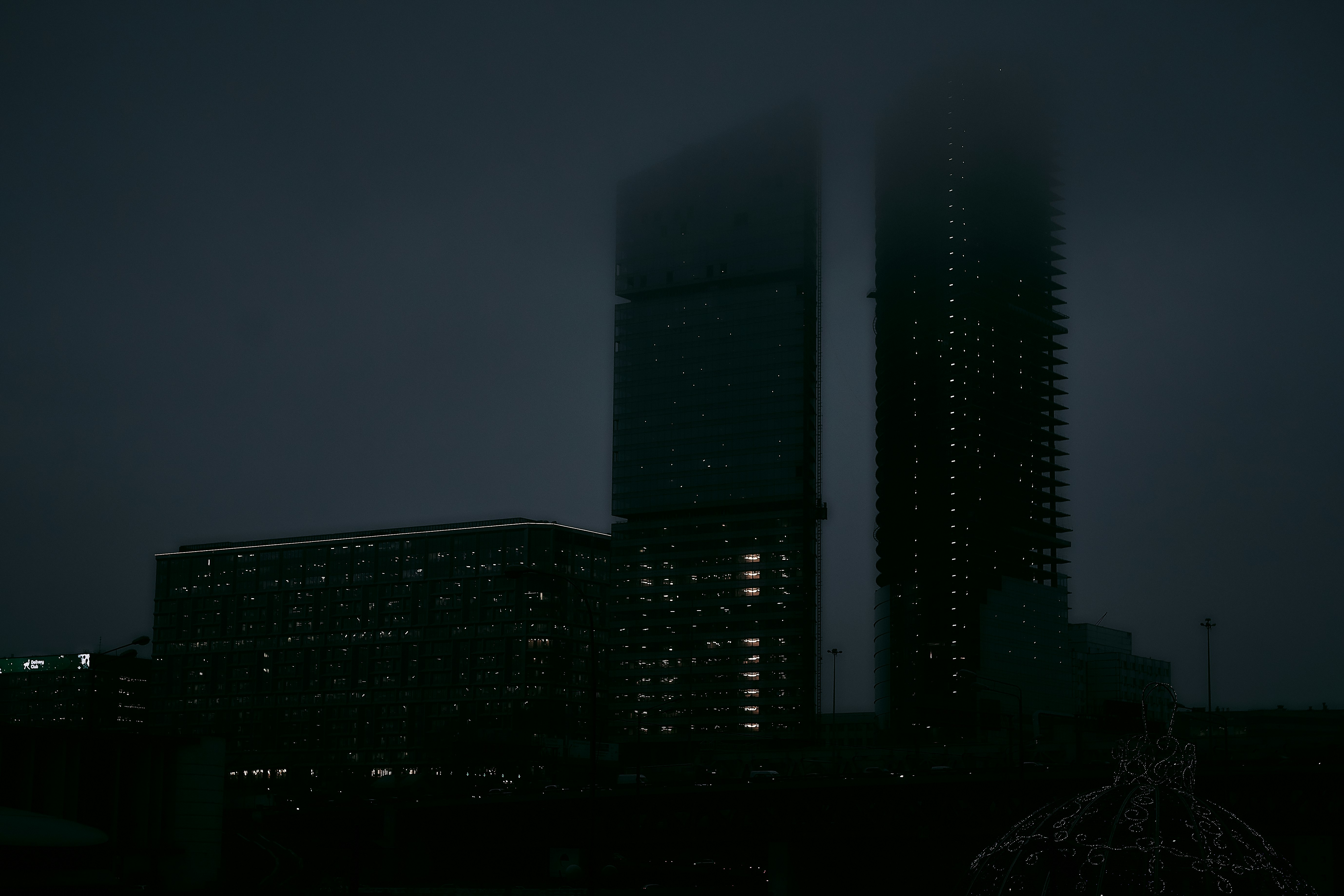 silhouette photography of high rise building