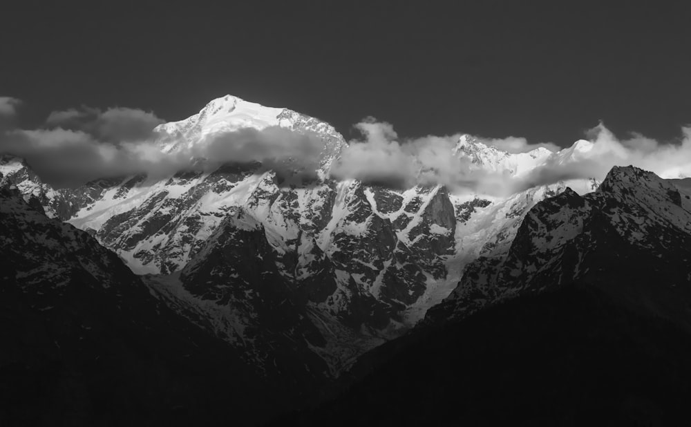 grayscale photography of mountain covered with snow