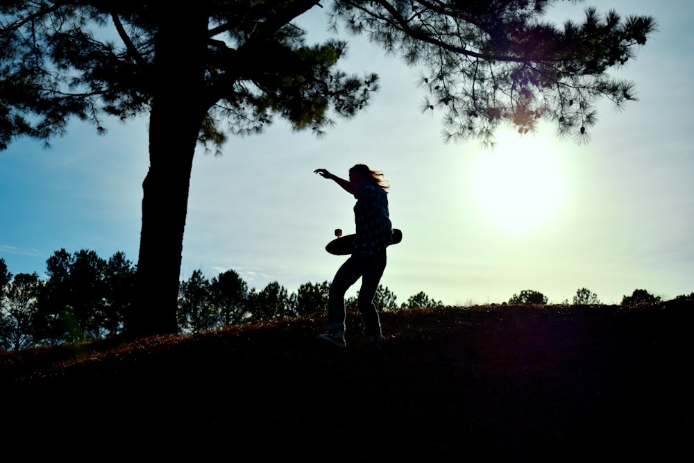 man walking on hill