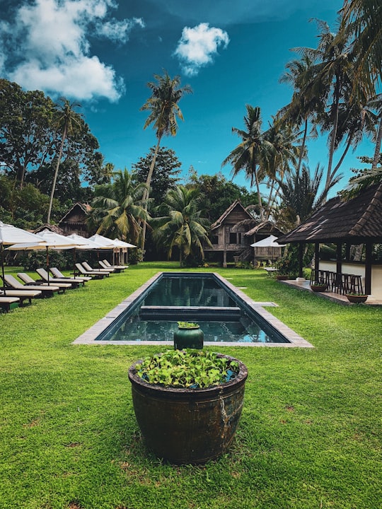 swimming pool in the middle of houses during daytime in Langkawi Malaysia