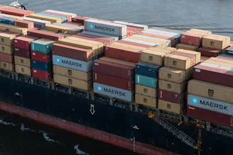 A cargo ship loaded with containers, symbolizing international trade.