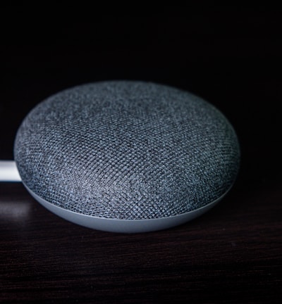 round gray portable speaker