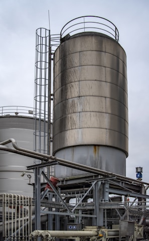 gray industrial factory under white sky