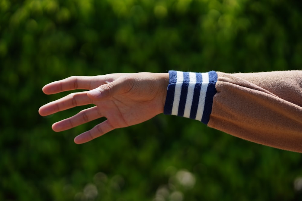 a person's arm with a wristband on it