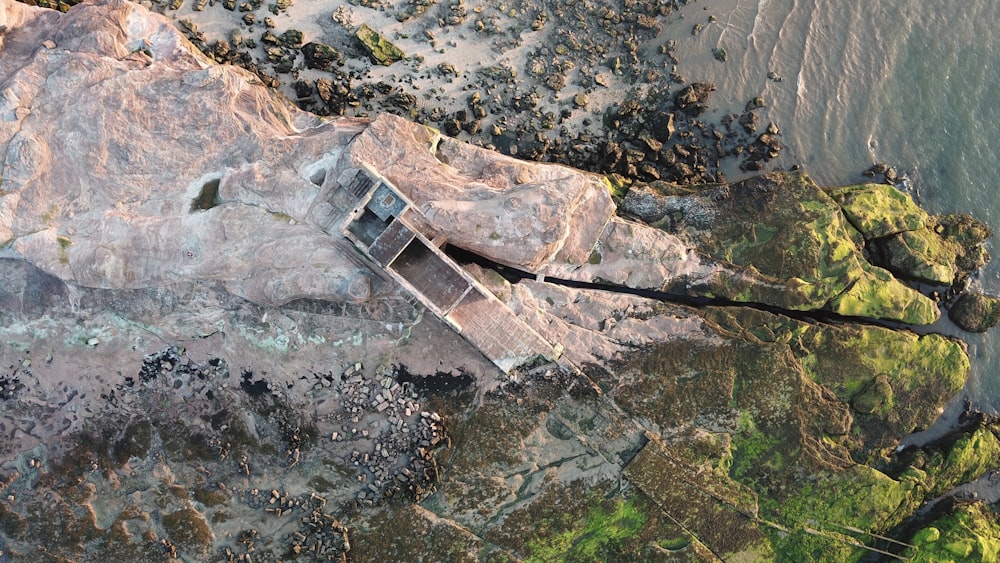 aerial photography of beach cliff and rock formations