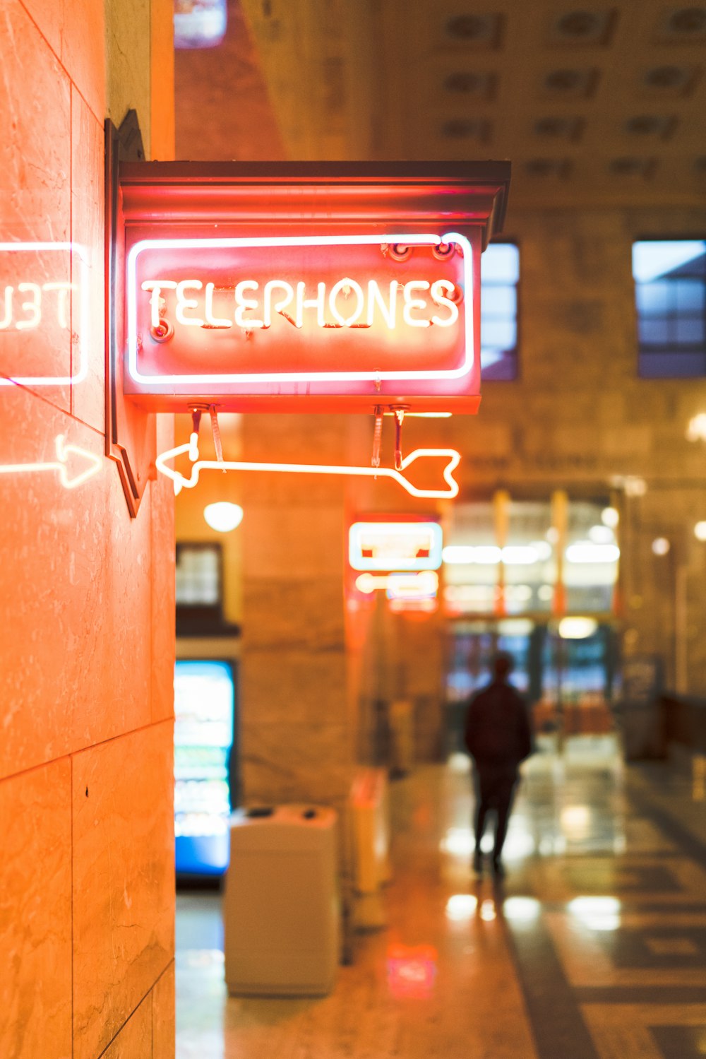 telephones neon light sign on wall