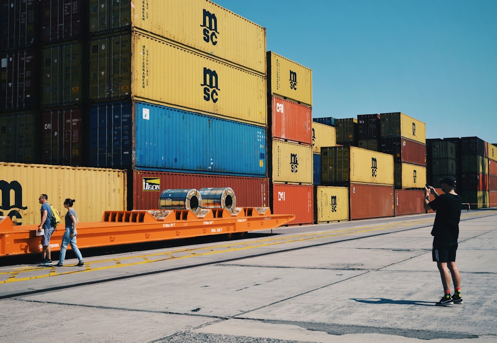 yellow, red, and blue intermodal containers