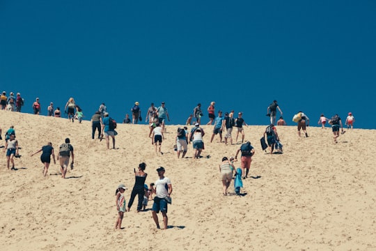 group of people on white sand in Dune du Pilat France