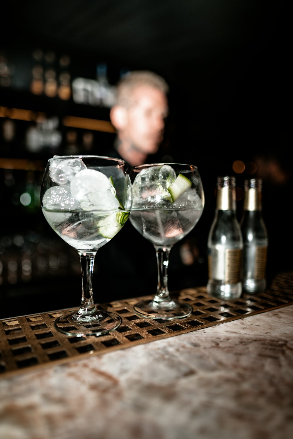 two clear glass long-stem drinking wine