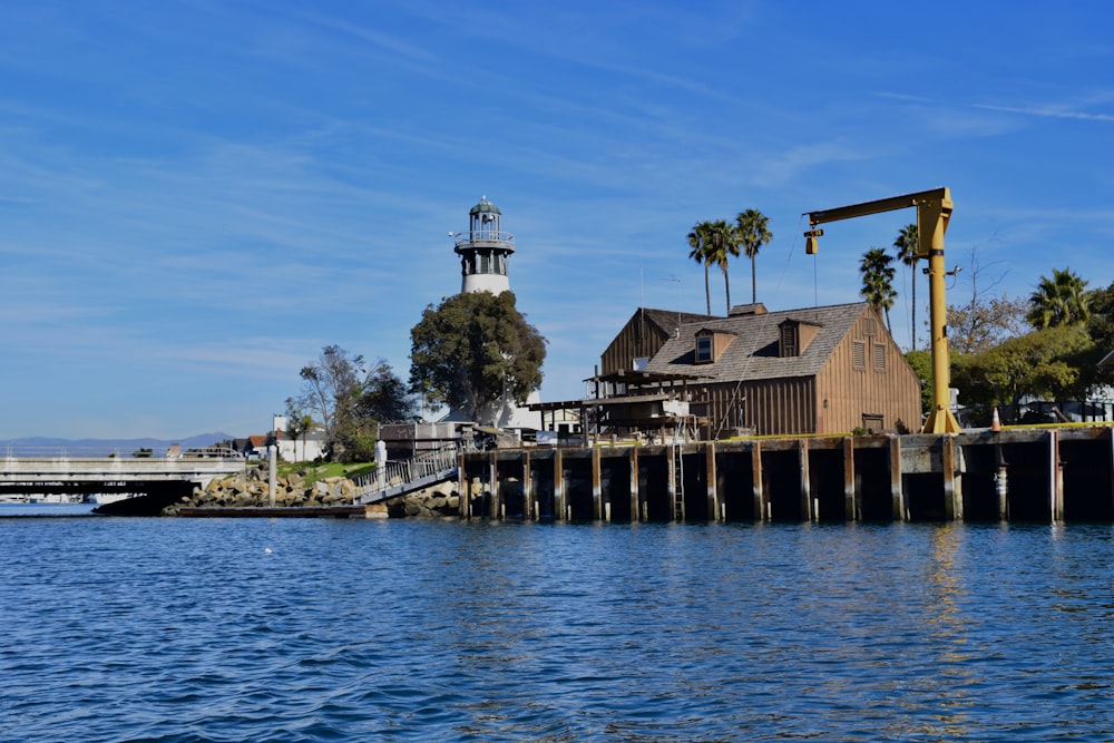 wooden structure beside body of water