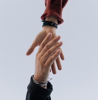 view of two persons hands