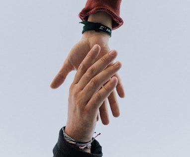 view of two persons hands