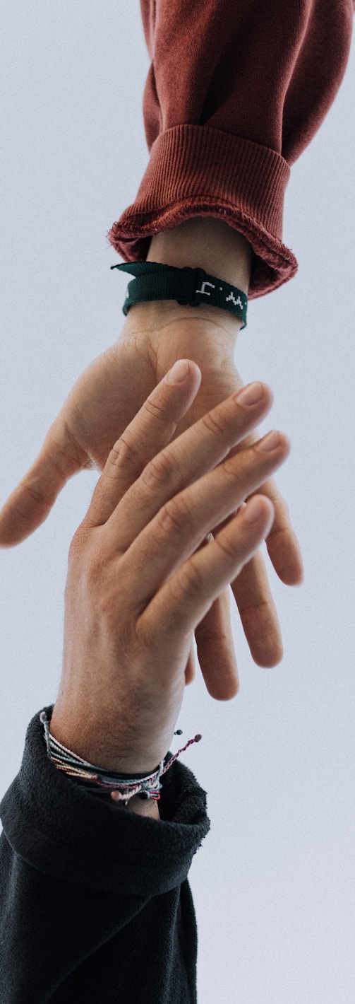 view of two persons hands