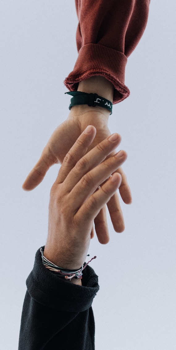 view of two persons hands