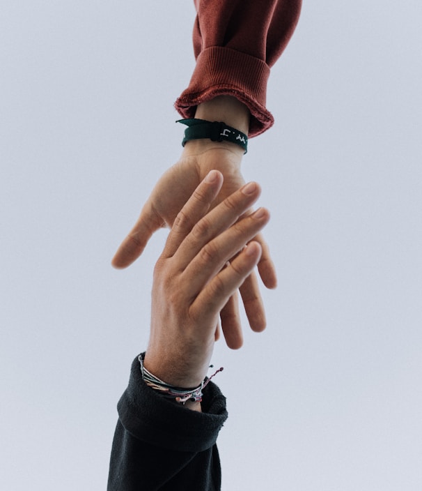 view of two persons hands