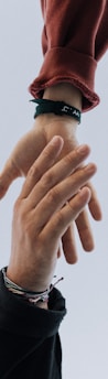 view of two persons hands