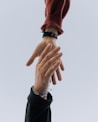 view of two persons hands