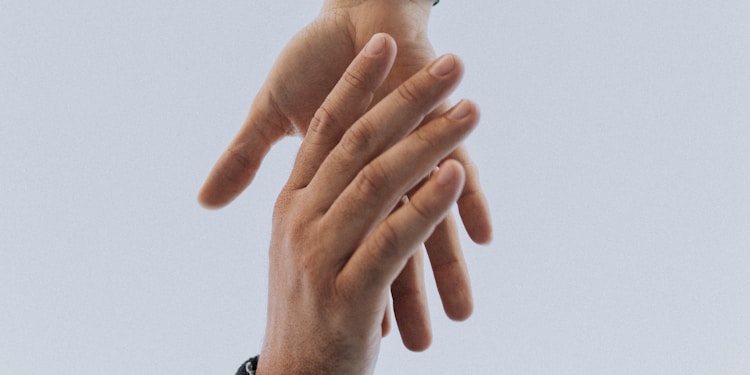 view of two persons hands