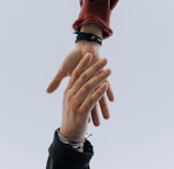 view of two persons hands