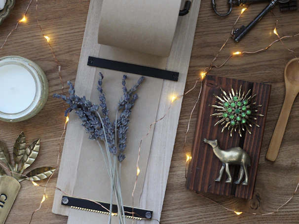 A cozy flat lay of Bella Bonim accessories on a wooden table with warm tones