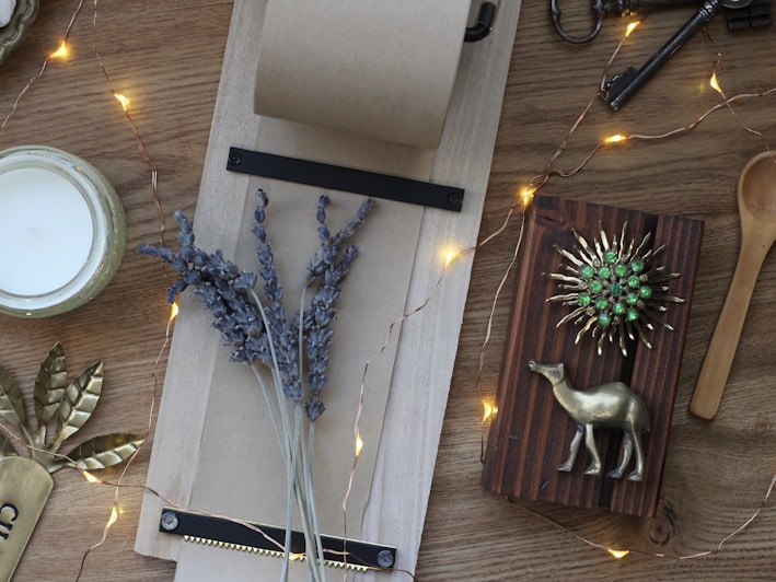 Flat lay of assorted scented candles on a wooden table