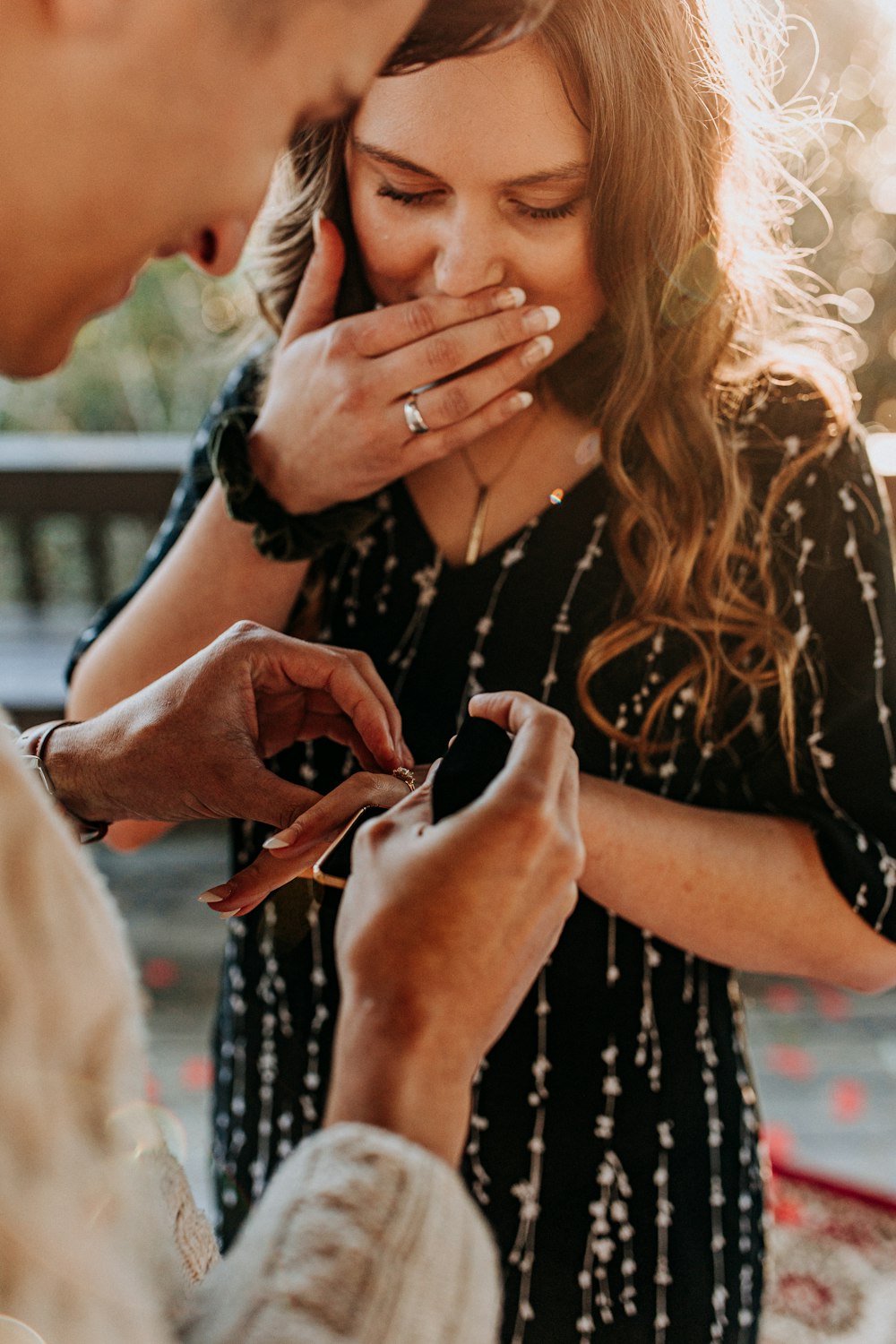 man wearing ring on womans ring finger