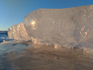 A breathtaking close-up of jagged ice formations sparkling under the soft morning light.