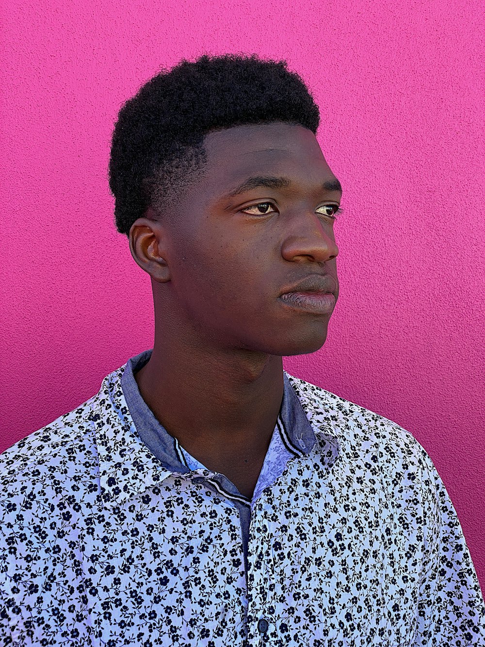 man wearing blue floral shirt