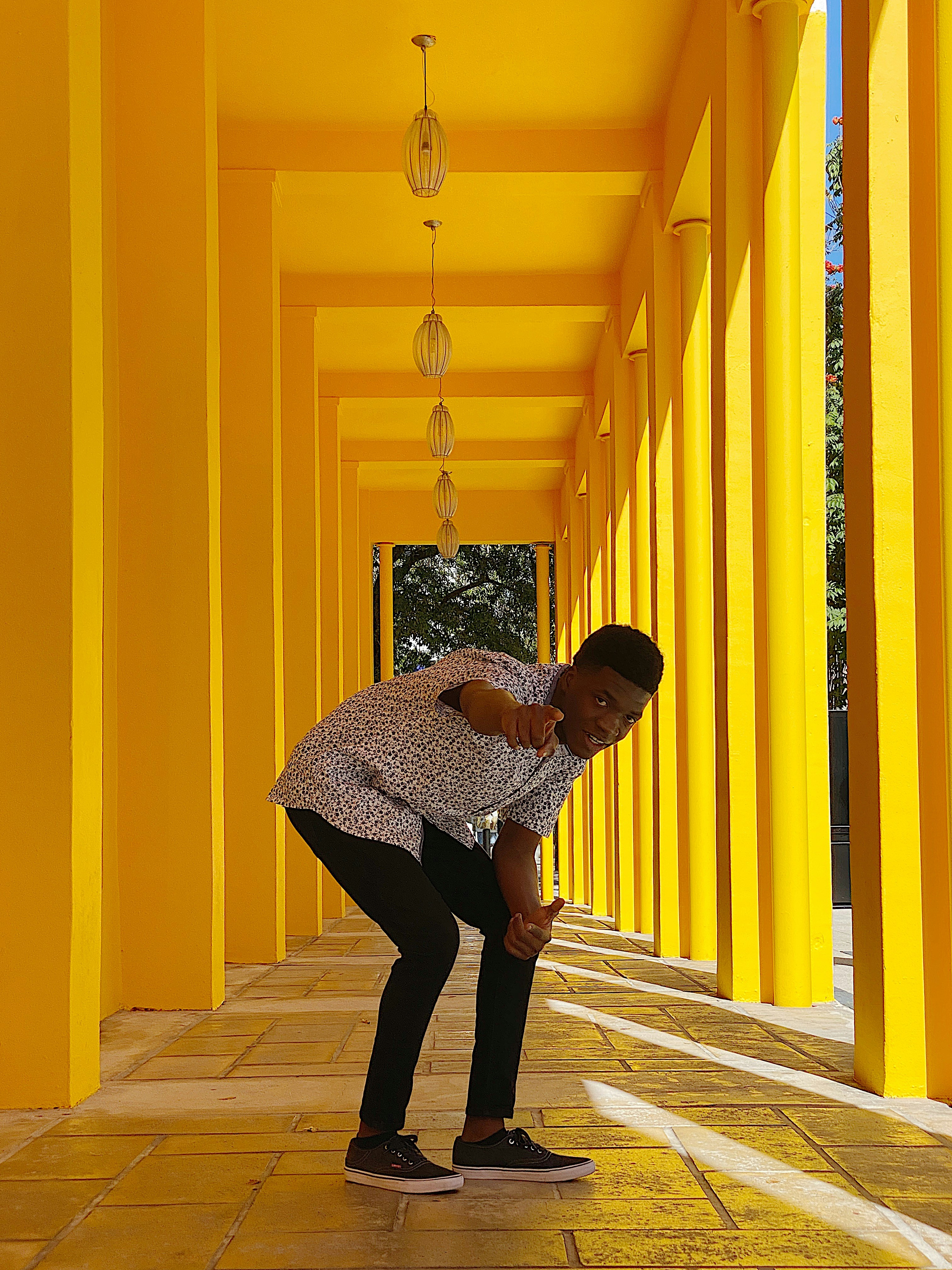 Person pointing at camera with bold yellow text overlay on bright background