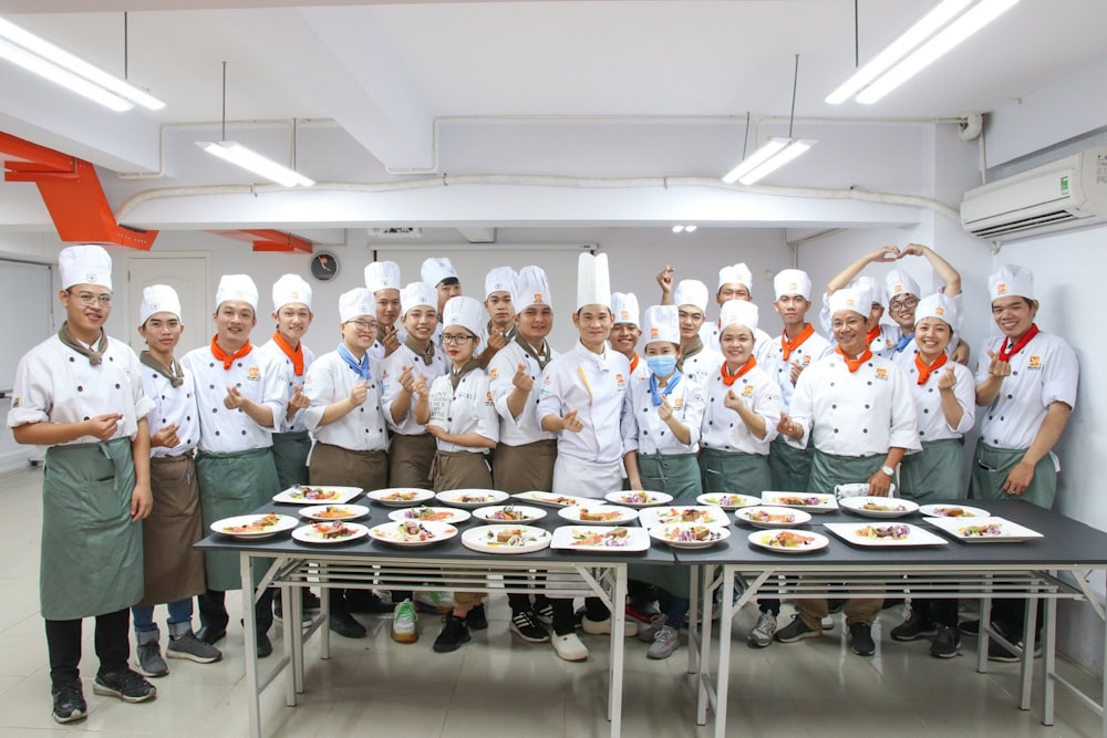 group of chef standing beside table