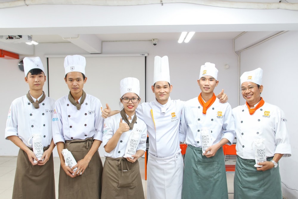 photography of group people inside room