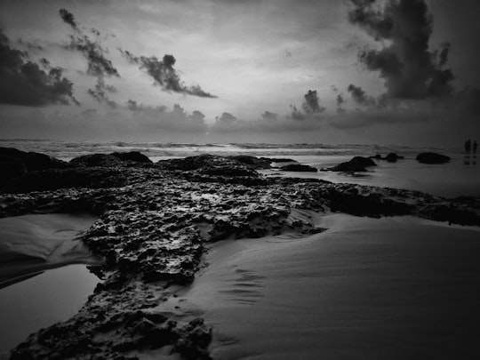 grayscale photography of stones and sand in Goa India