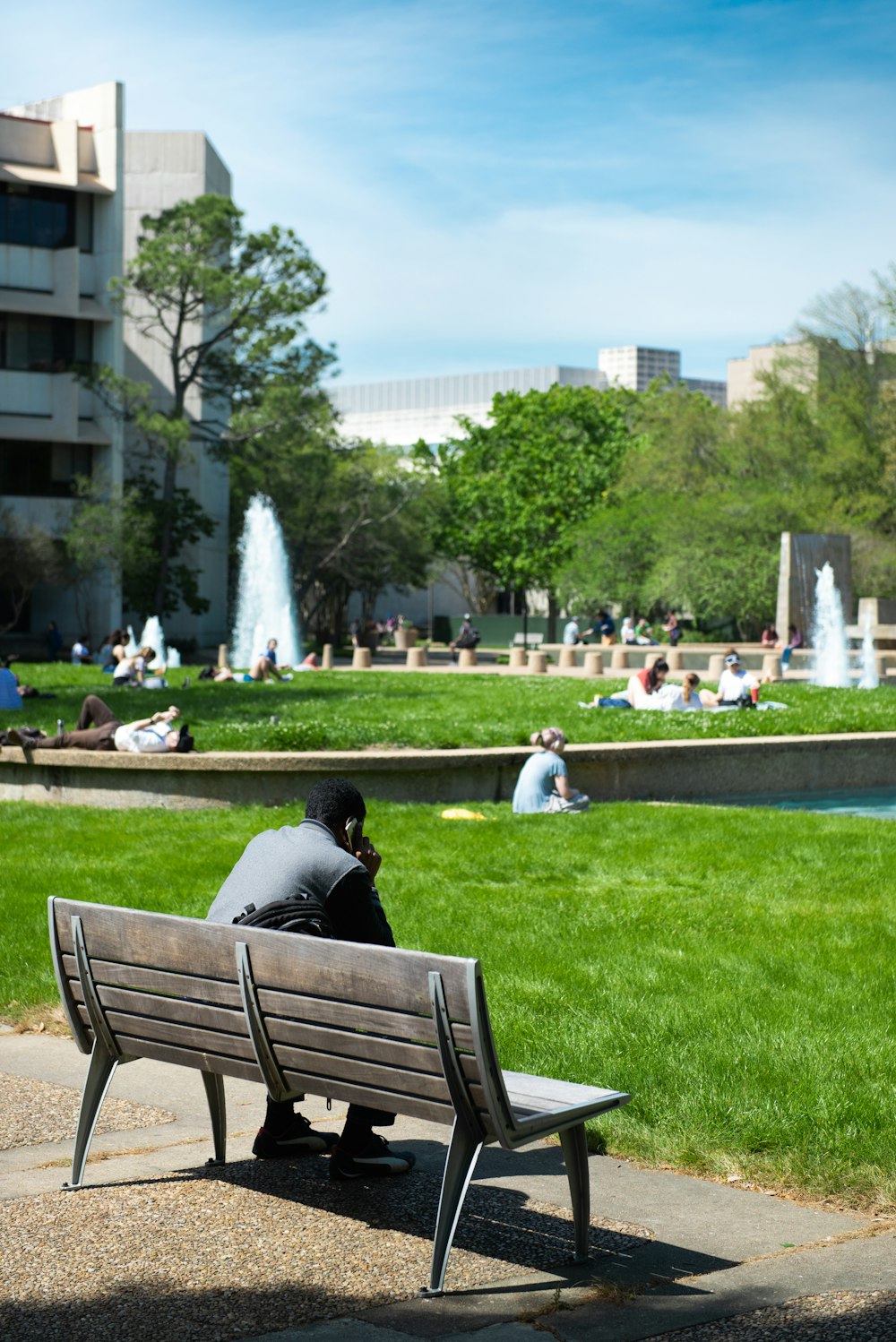 man sitting on bench during daytime