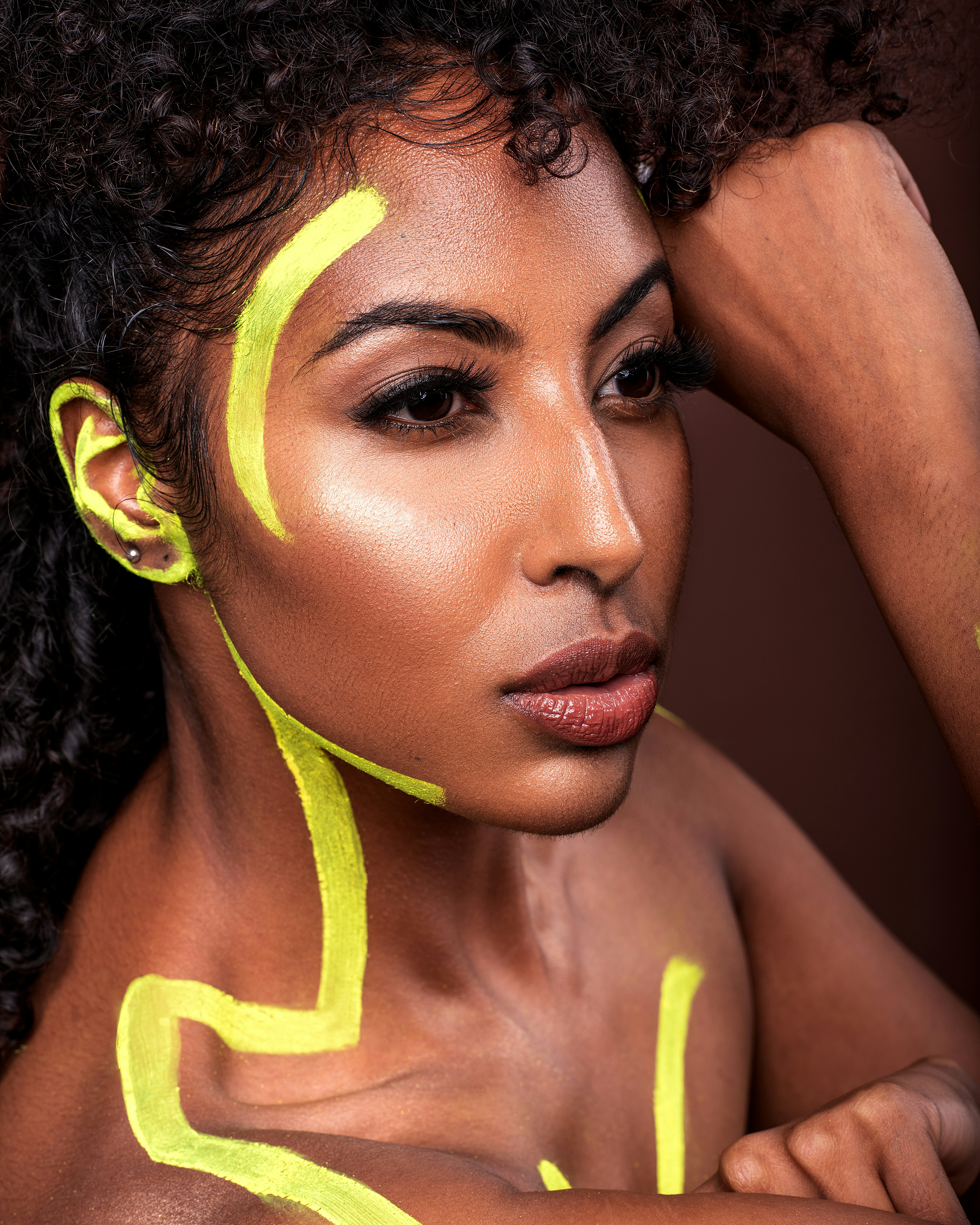 A woman with yellow lines painted on her face photo – Free Black Image ...