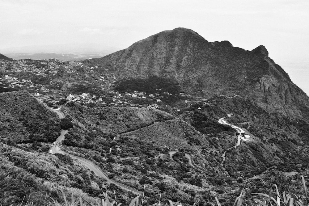 grayscale photography of mountain during daytime