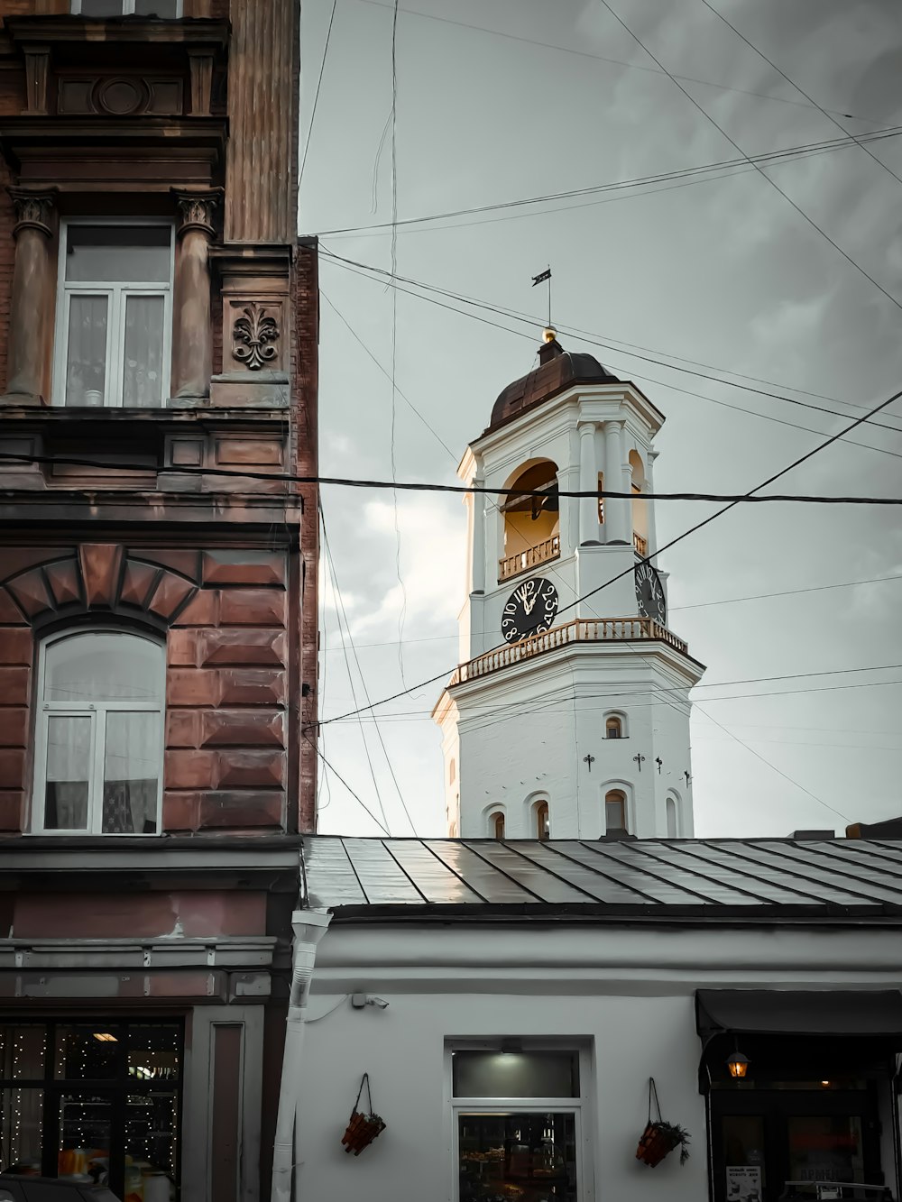 white concrete clock tower