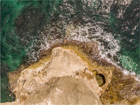 aerial photo of cliff near body of water in Bohol Philippines