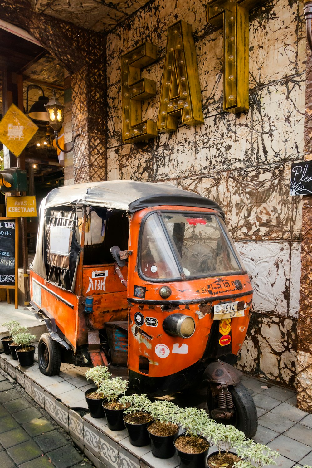 orange auto-rickshawl