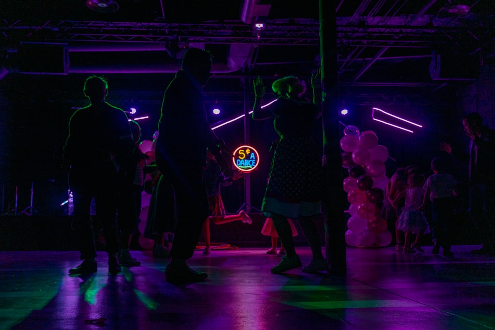 people dancing in event during night time