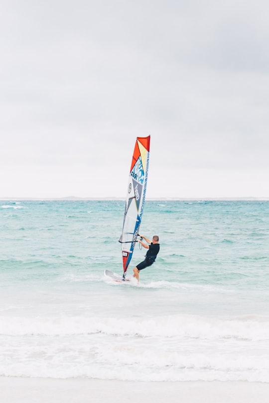 shallow focus photo of person riding surfboard in Struisbaai South Africa