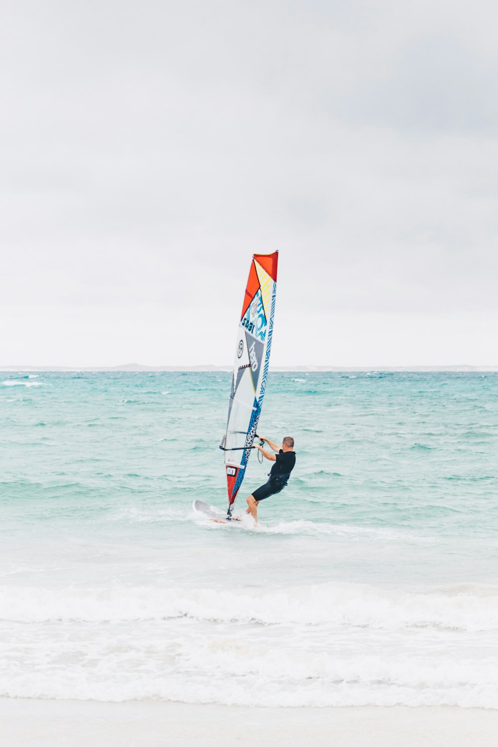 shallow focus photo of person riding surfboard