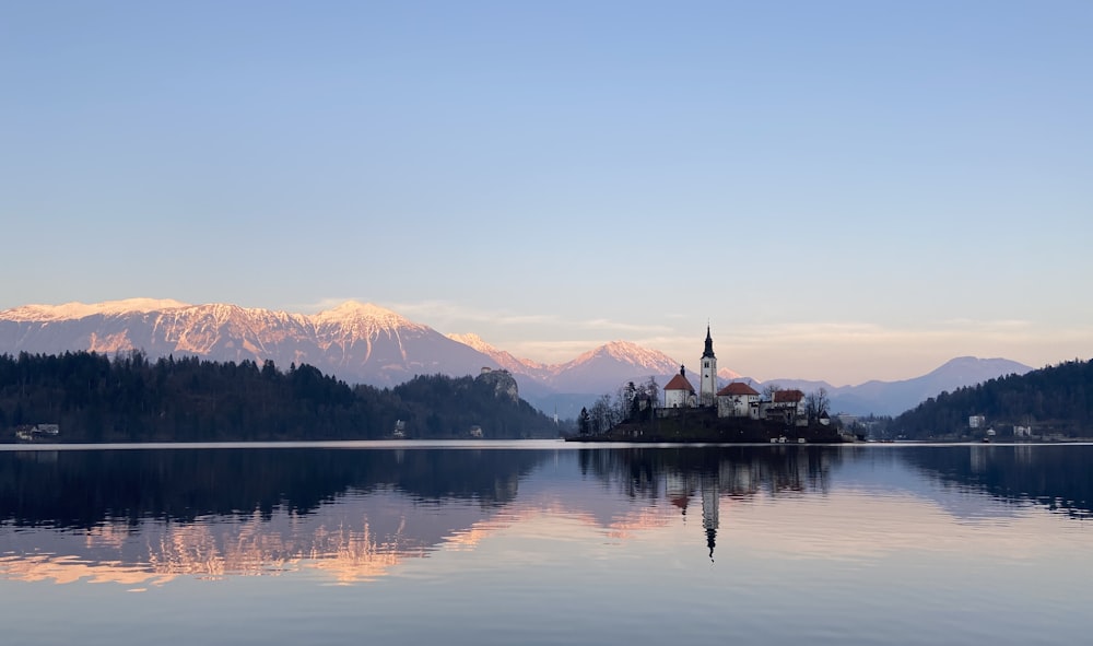 reflection of house on body of water during golden hour