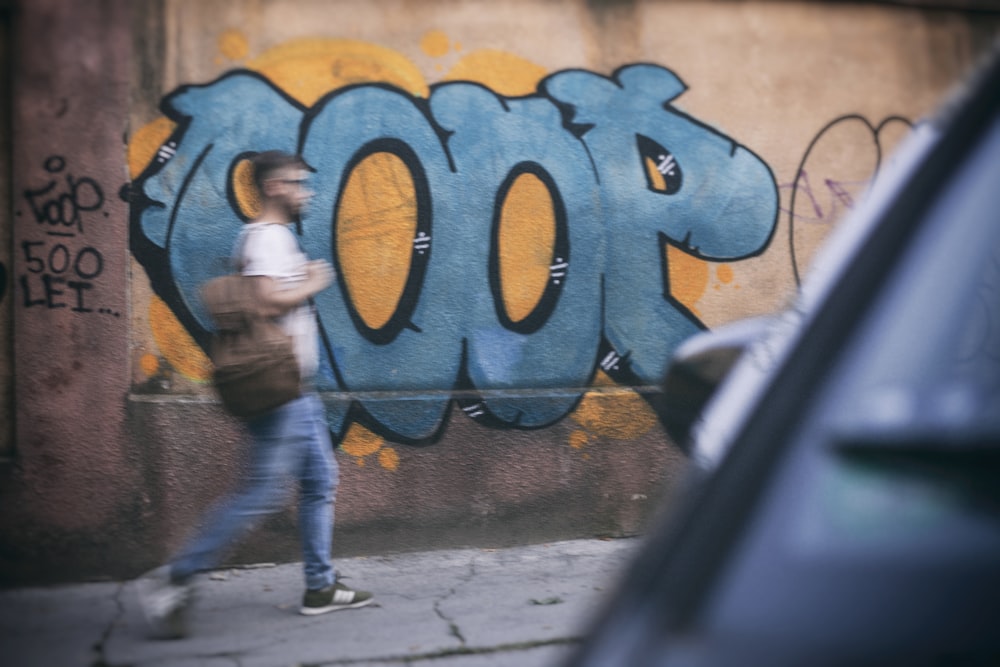 man walking on sidewalk